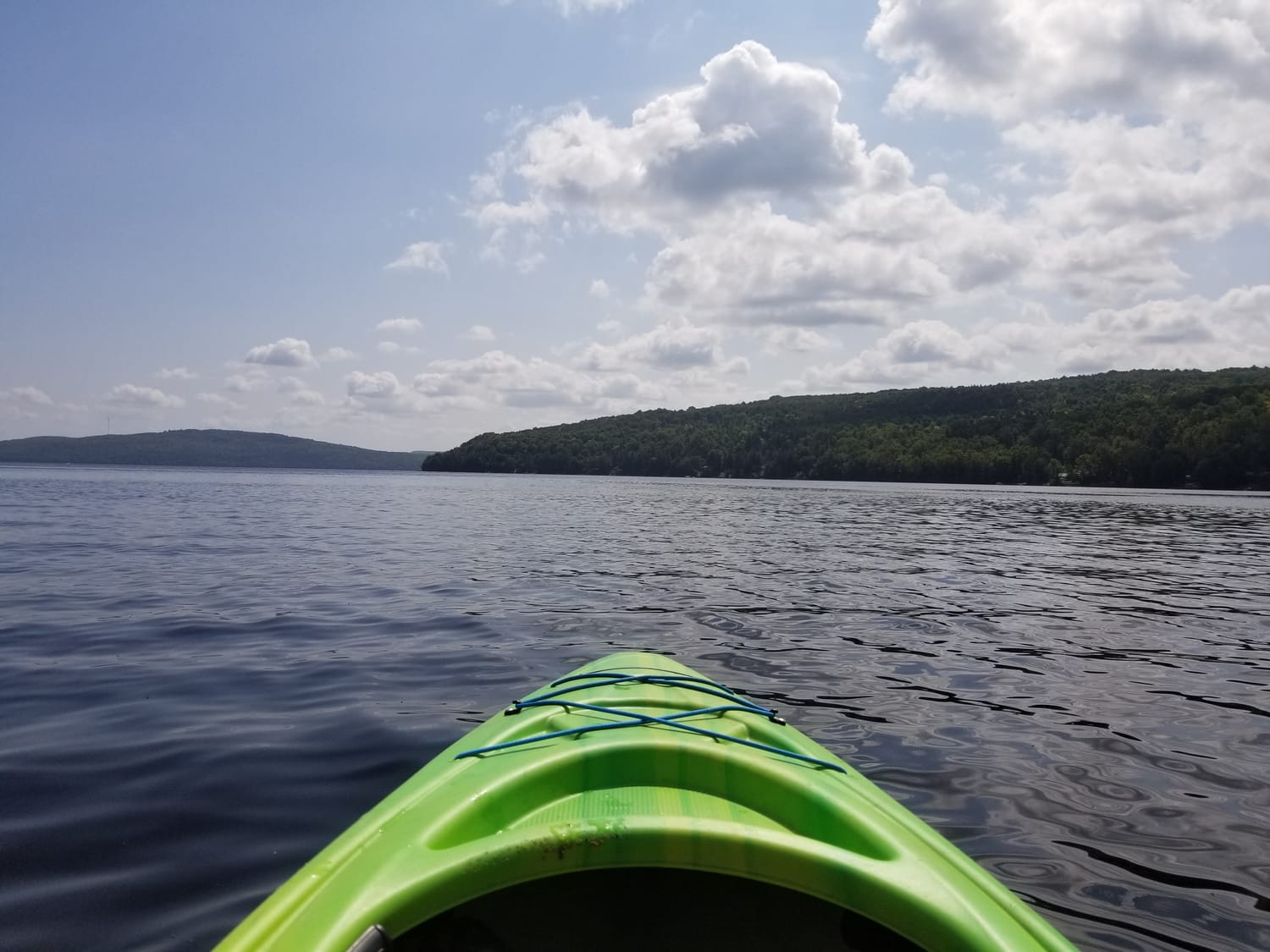 Photo: View from a green kayak floating on a calm lake in Canada on a beautiful sunny August day. This is my idea of pure happiness.