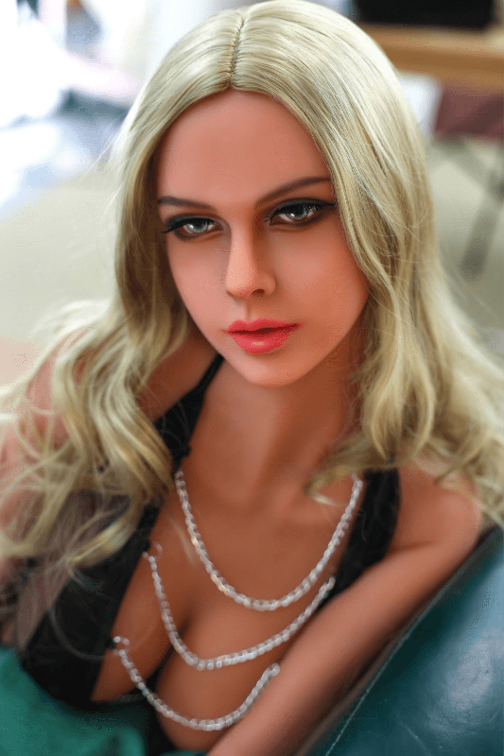 Sasha Blaze life-size silicone companion doll seated position