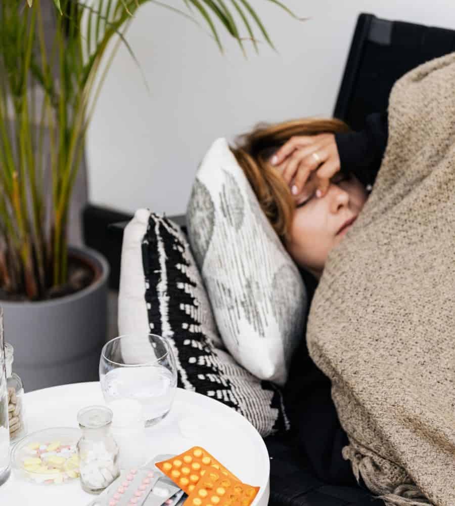 Woman feeling unwell and exhausted, seeking natural alternatives to chronic illness.