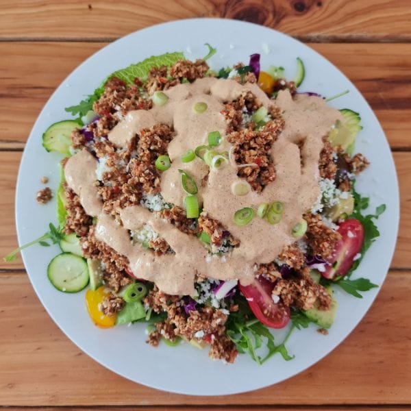 Raw activated walnut crumble salad with tahini dressing