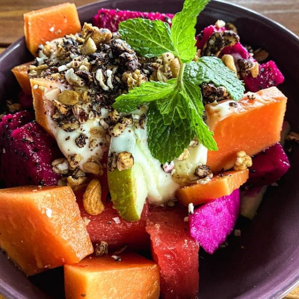 Papaya and dragon fruit bowl with yogurt and granola, a Raw Reset meal example