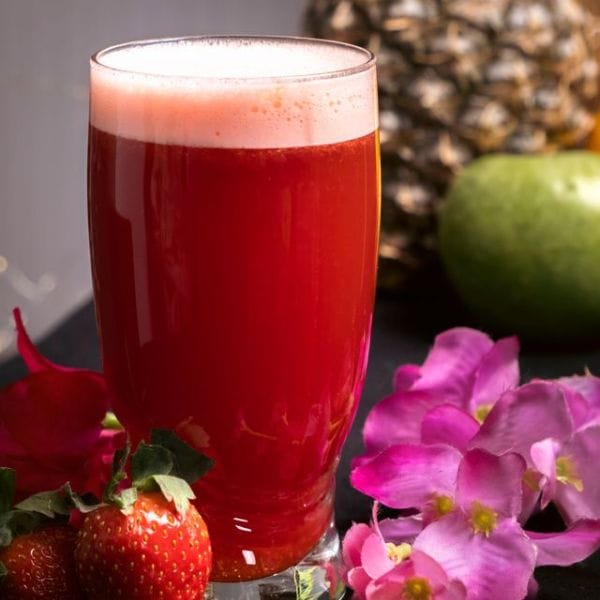 Fresh red juice with strawberries and pineapple, a Raw Reset meal example