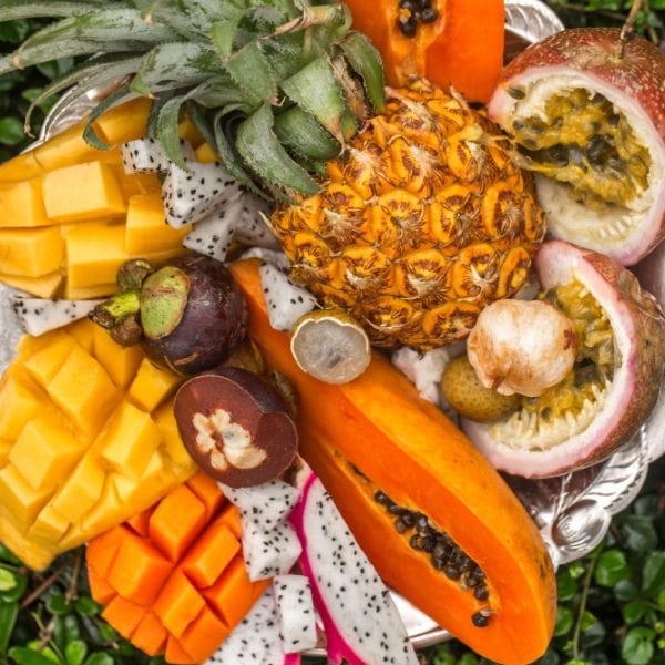Tropical fruit platter with mango, dragon fruit, pineapple and passion fruit for natural detoxification