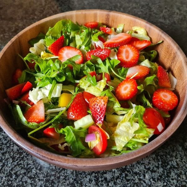 Strawberry and arugula salad with cherry tomatoes for holistic detox