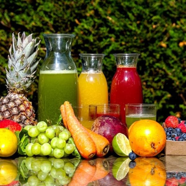 Fresh raw green, yellow and red juices with whole produce for detox and healing