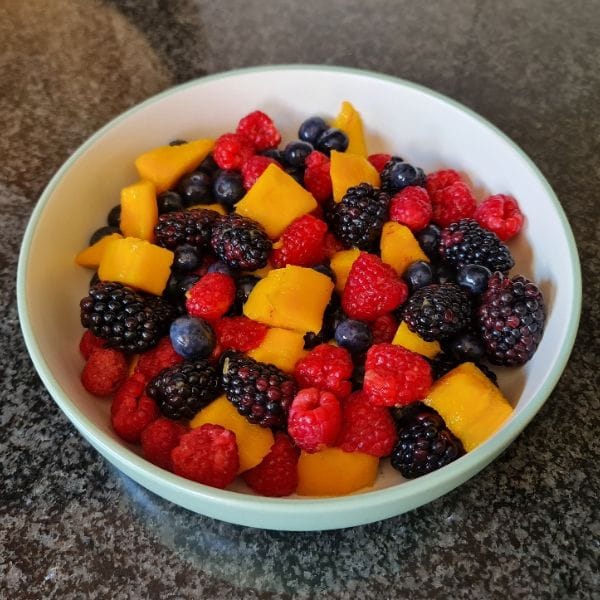 Mixed berry and mango bowl supporting natural healing
