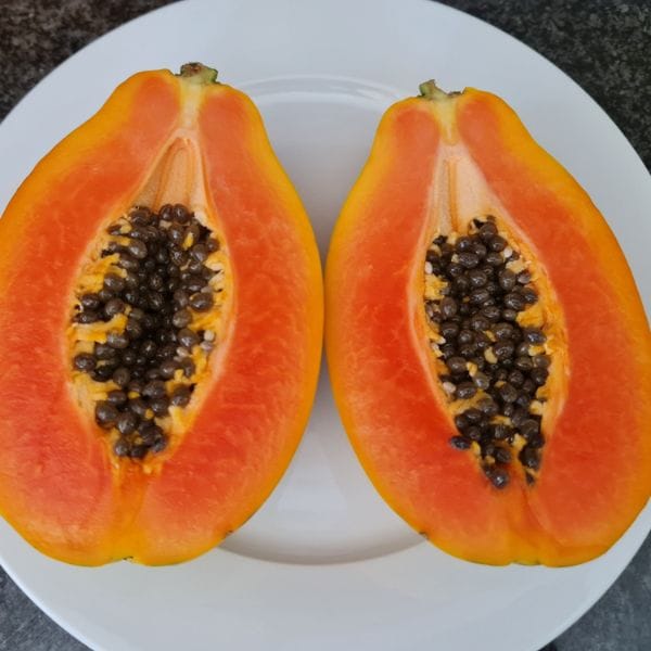 Fresh papaya halves with seeds, part of a Detox and Heal meal plan
