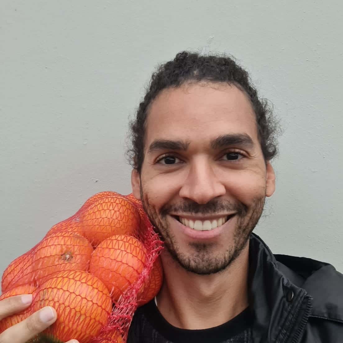 Ceferino Cenizo holding oranges