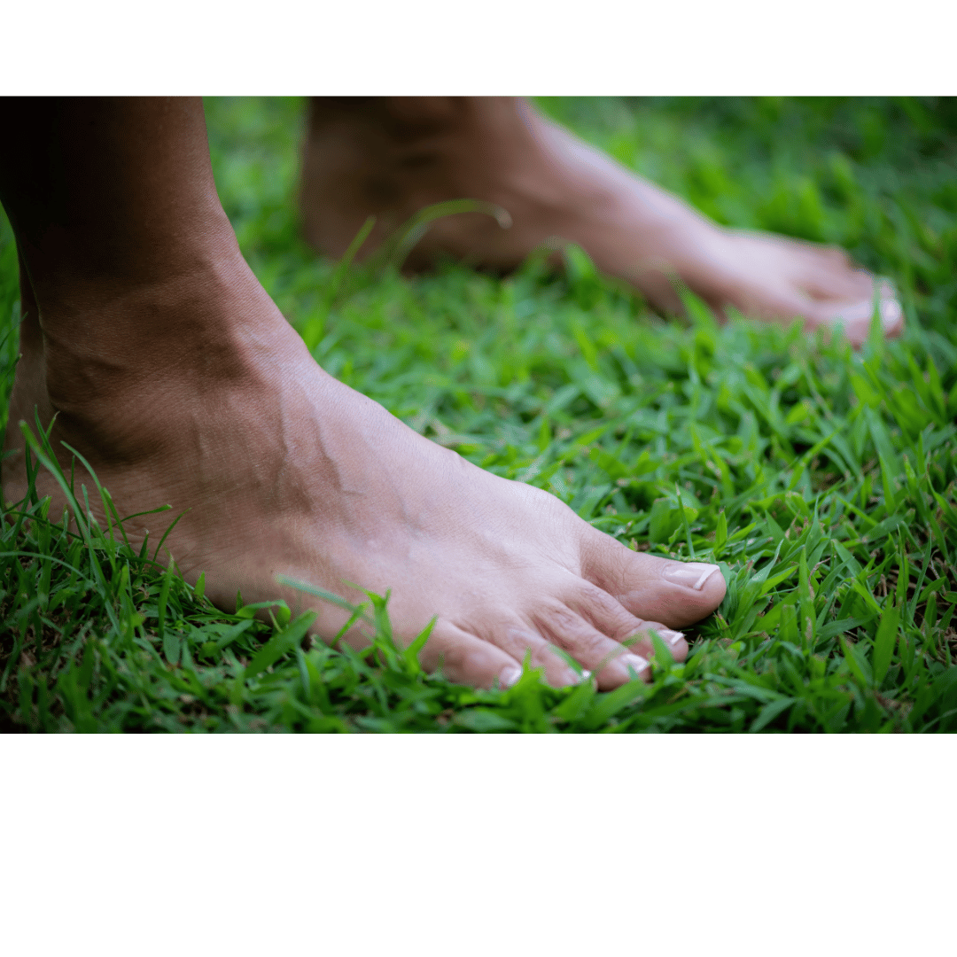 An image of a person writing in a journal, on a desk with a coffee and croissant next to her on the table