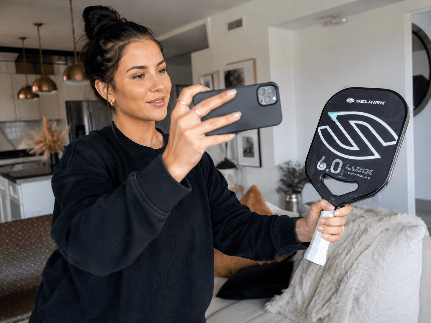 A creator filming a simple product review with a phone