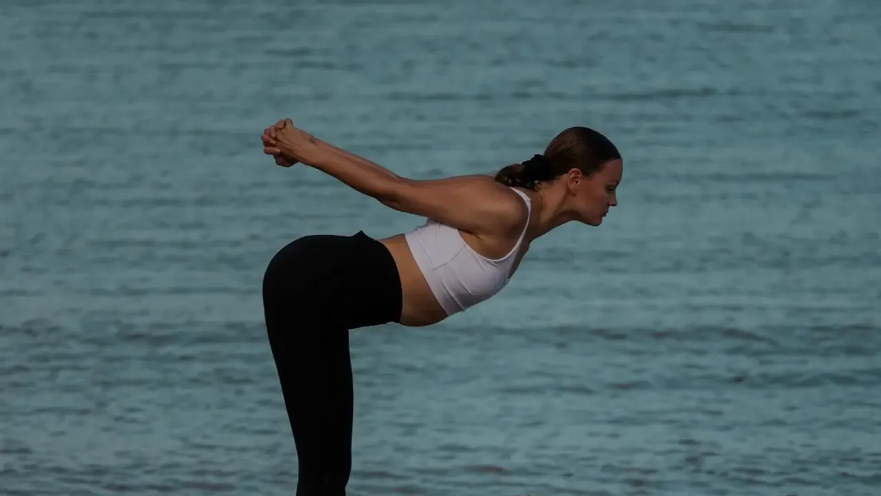 "Sini Hietaharju as a yoga model and photographer, demonstrating a powerful asana in nature