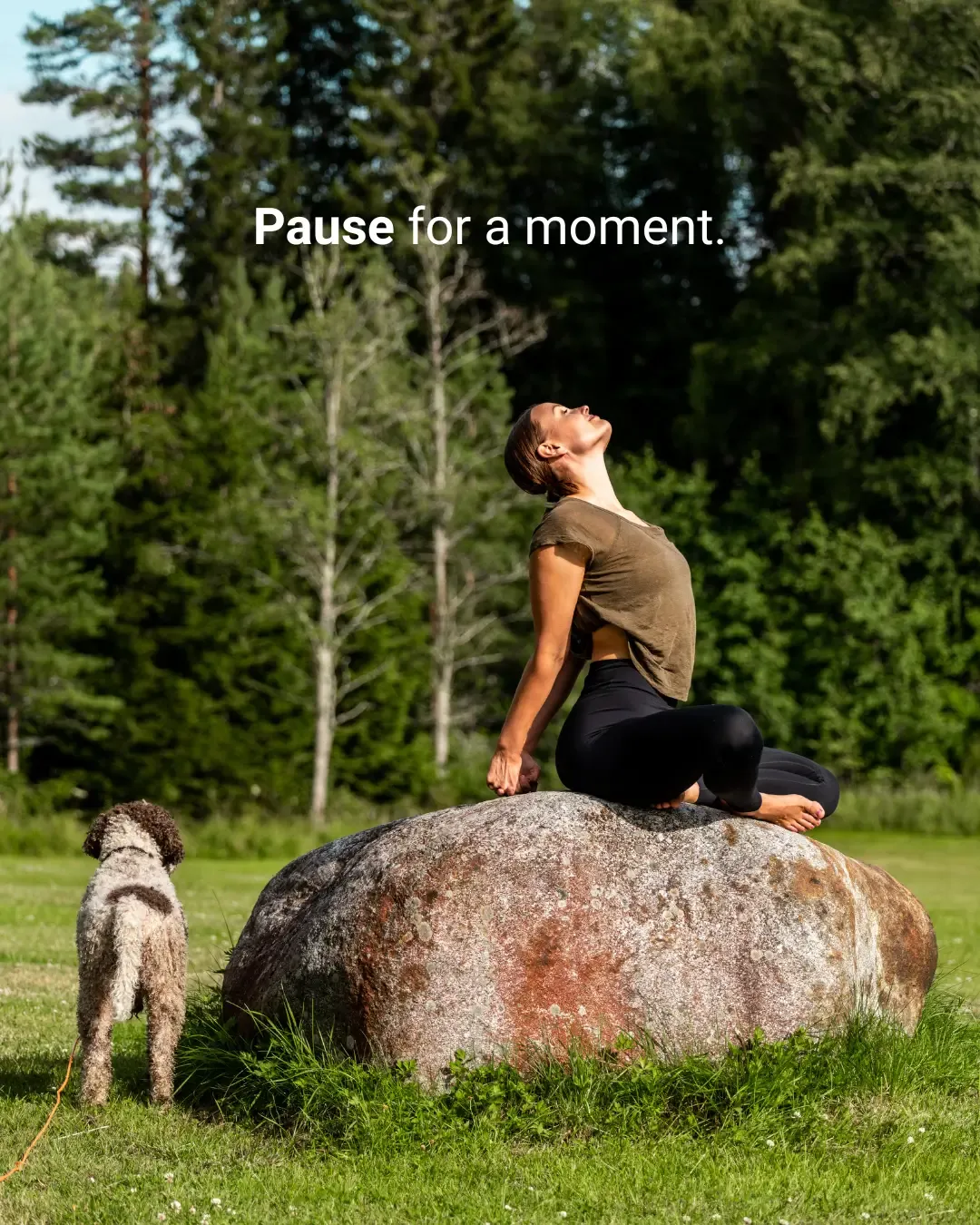 sini on yoga pose on a rock in finnish forest