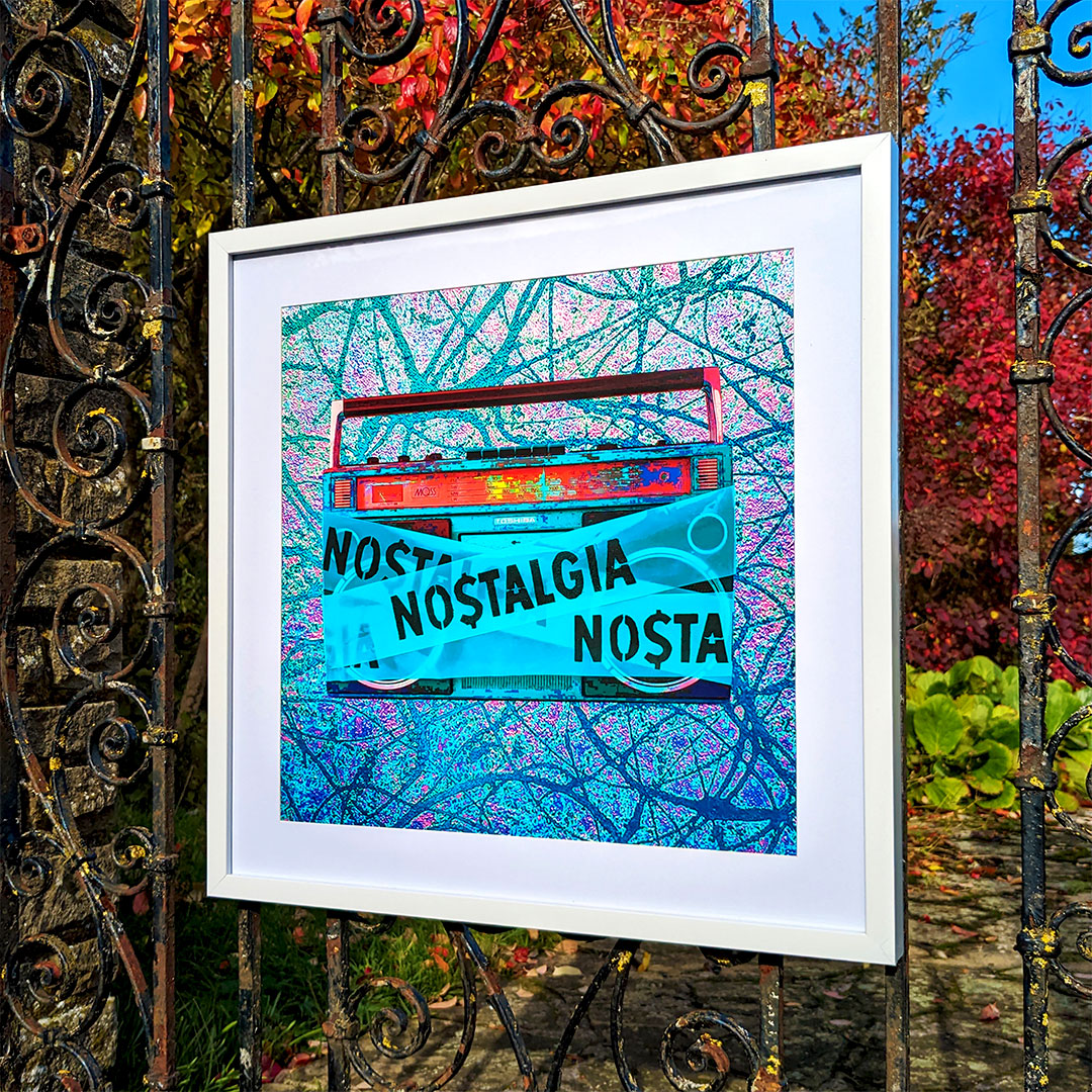 Framed digital artwork hanging on a weathered iron gate