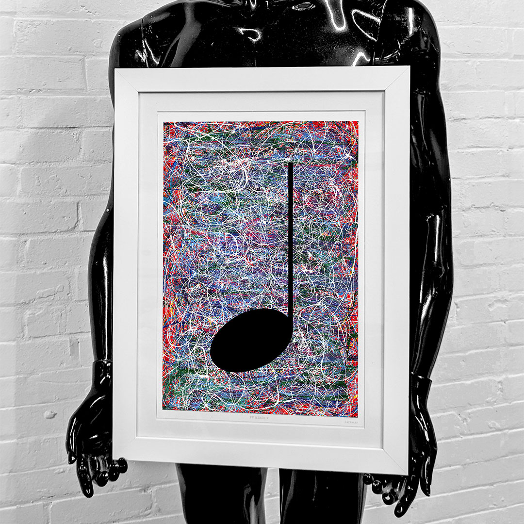 black mannequin holding a framed giclée print of a red music graffiti painting