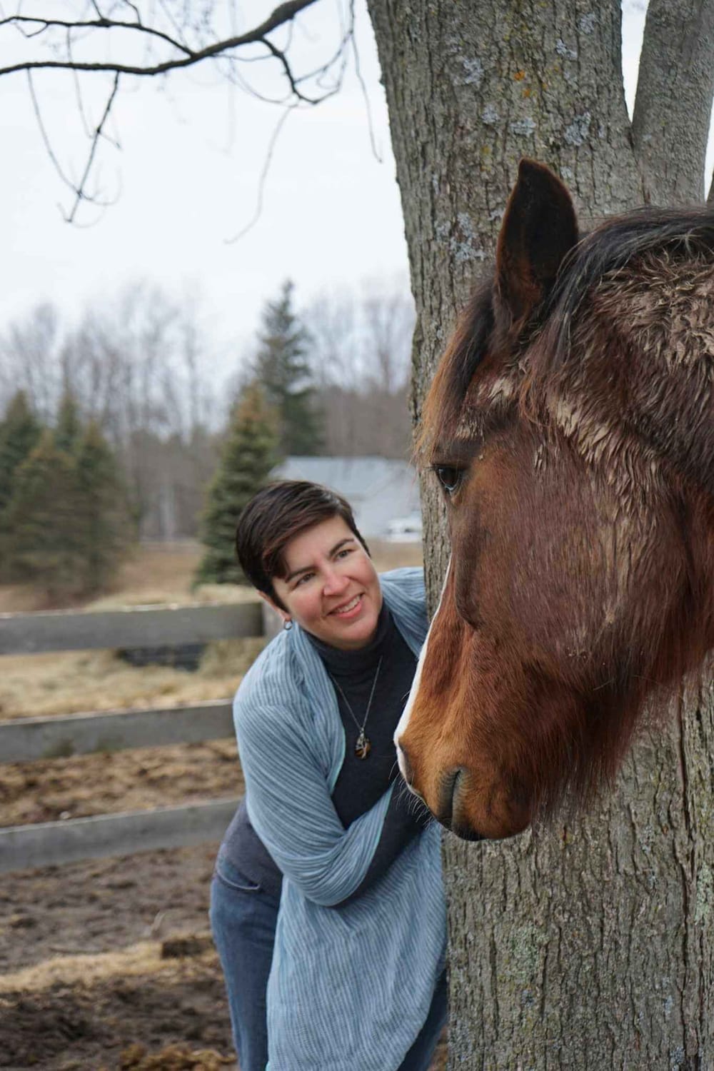 Monica Gilkes, Certified FEEL Practitioner, sharing a quiet moment with a horse at Spirited Hooves