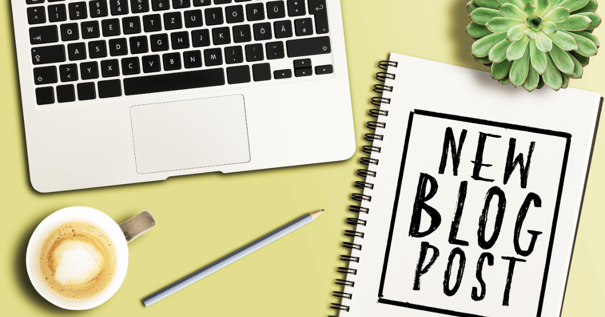 A visual representation of a content creator's workspace, showing a laptop, a notebook with the words "NEW BLOG POST," a cup of coffee, a pencil, and a succulent plant on a yellow desk.