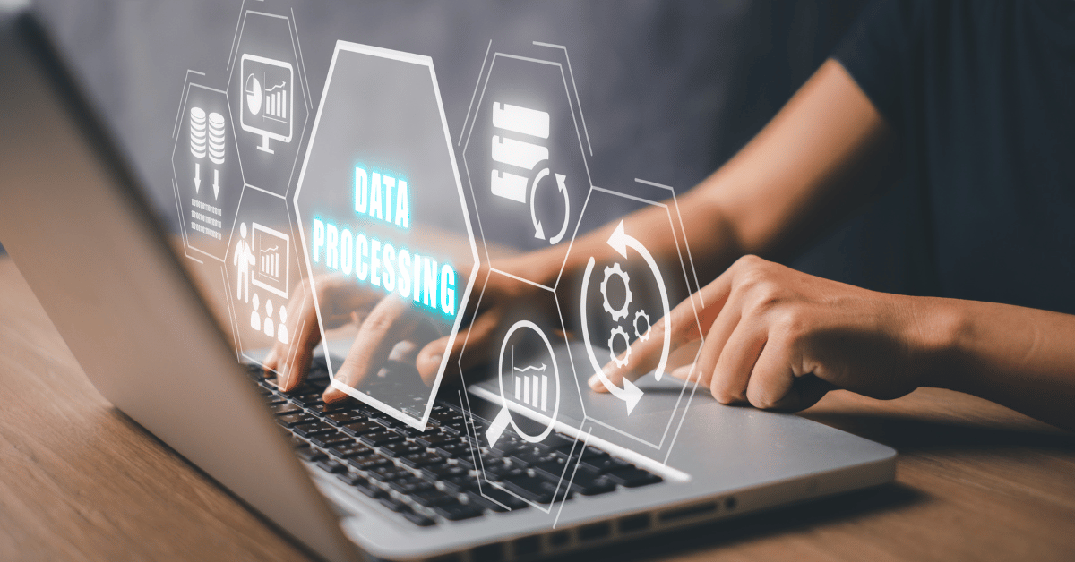 A visual representation of data processing in the digital age, showing a person working on a laptop with a holographic interface displaying the words "DATA PROCESSING" and related icons.