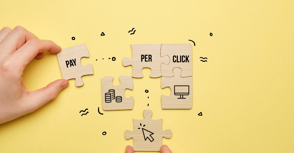 A visual representation of PPC advertising, featuring hands assembling puzzle pieces to reveal the term "PAY PER CLICK," emphasizing the strategic nature of this marketing approach.