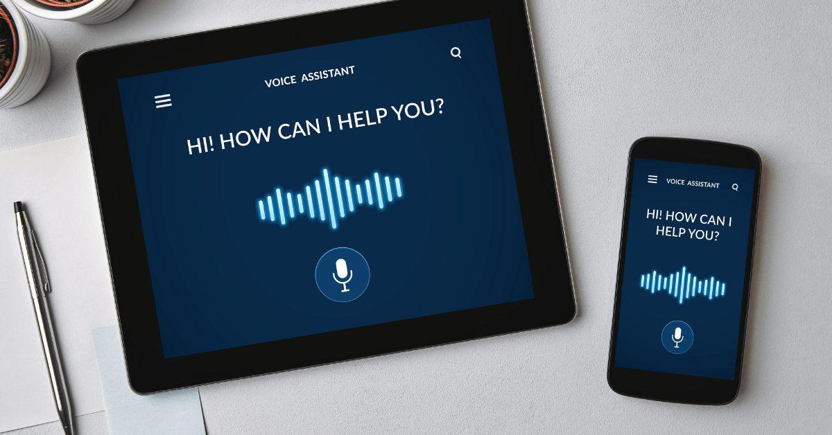 A visual representation of voice assistant technology, featuring a tablet and smartphone screens displaying voice assistant interfaces with a microphone icon.