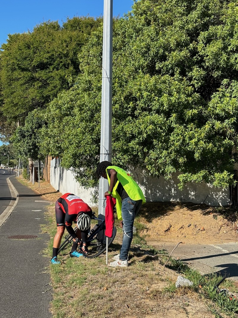 CTcycle Tour 2024 - Cyclist Pumping Wheel Just Before Suikerbossie Climb Hout Bay
