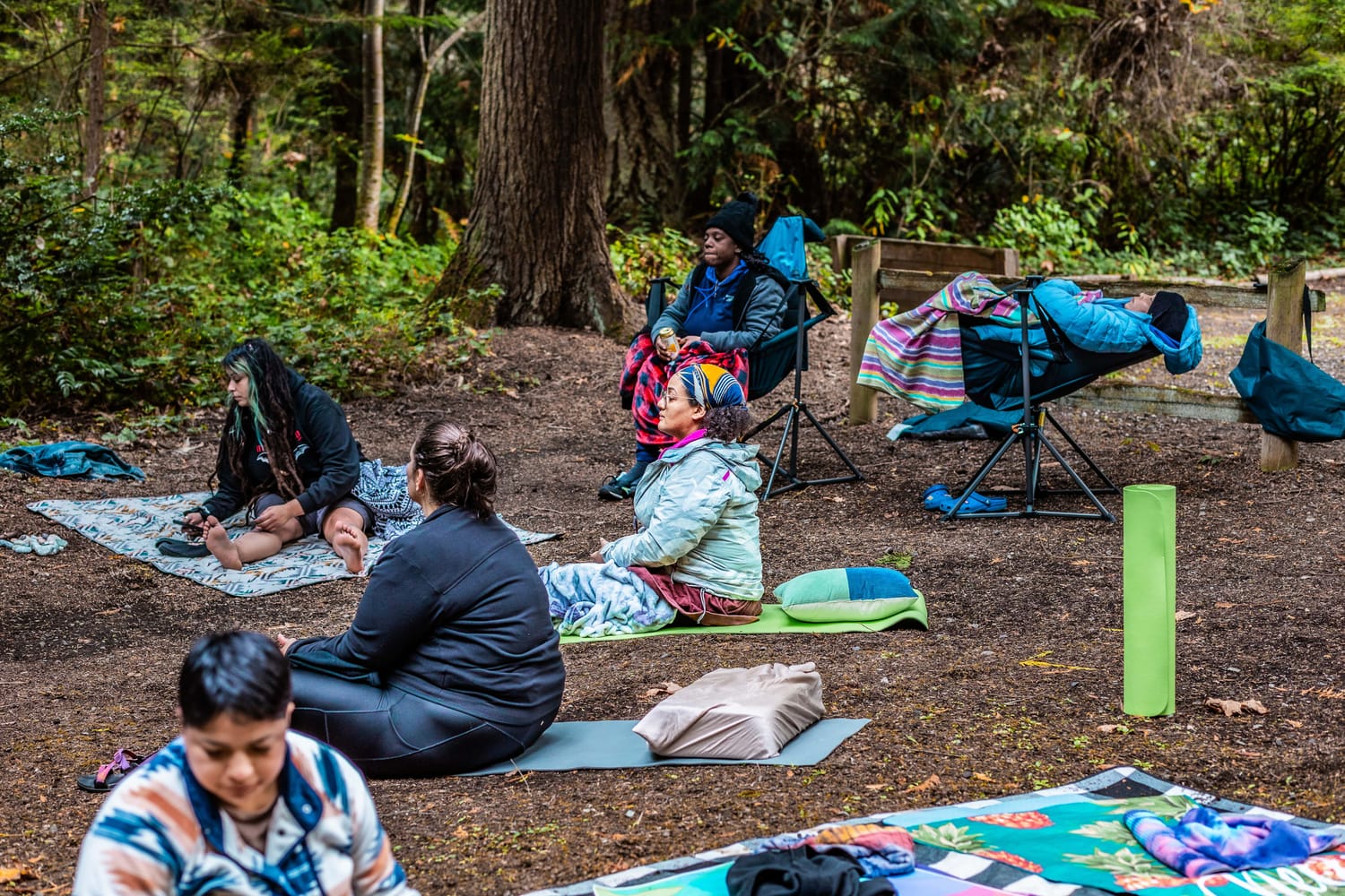 ZoZ Experience Co-Founder, Justice Reign, enjoying forest bathing during a sound bath at Camp ZoZ. 