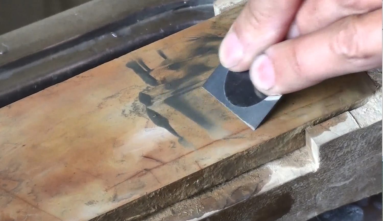 Close-up comparison of a Japanese chisel blade before and after sharpening, showing dull and polished edges