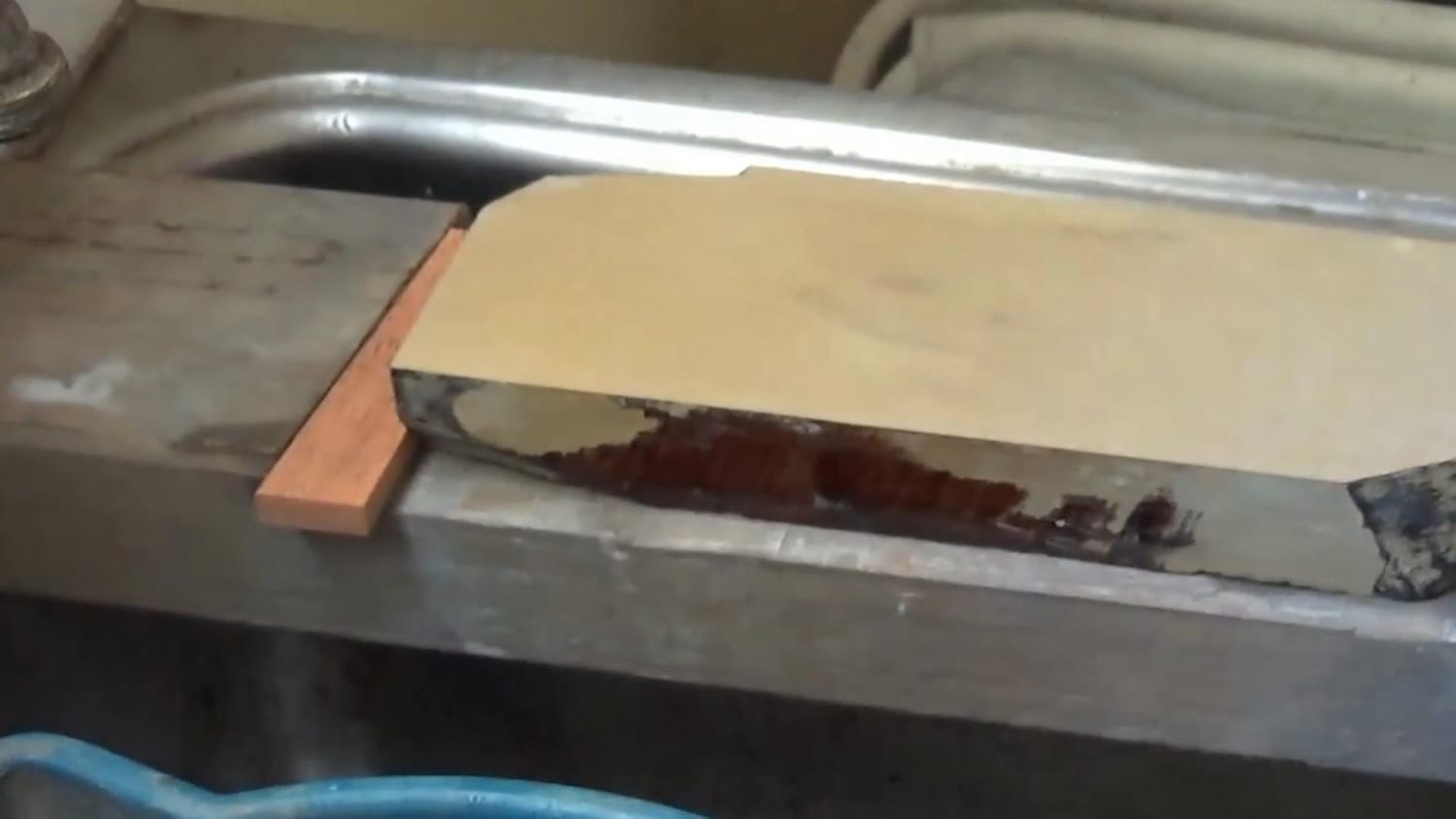 Sharpening stone secured with a wedge