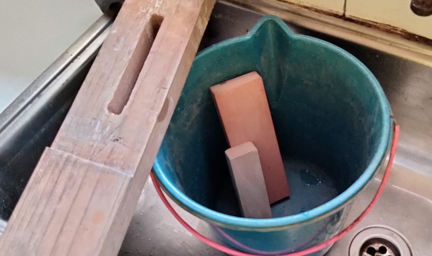 Sharpening bucket emptied after use