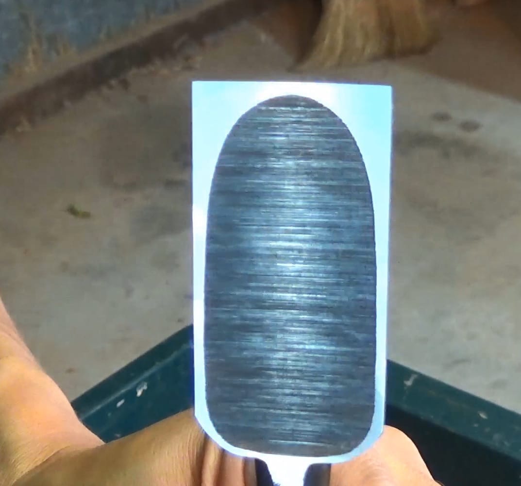 Close-up of a Japanese chisel back showing a flat, polished surface.
