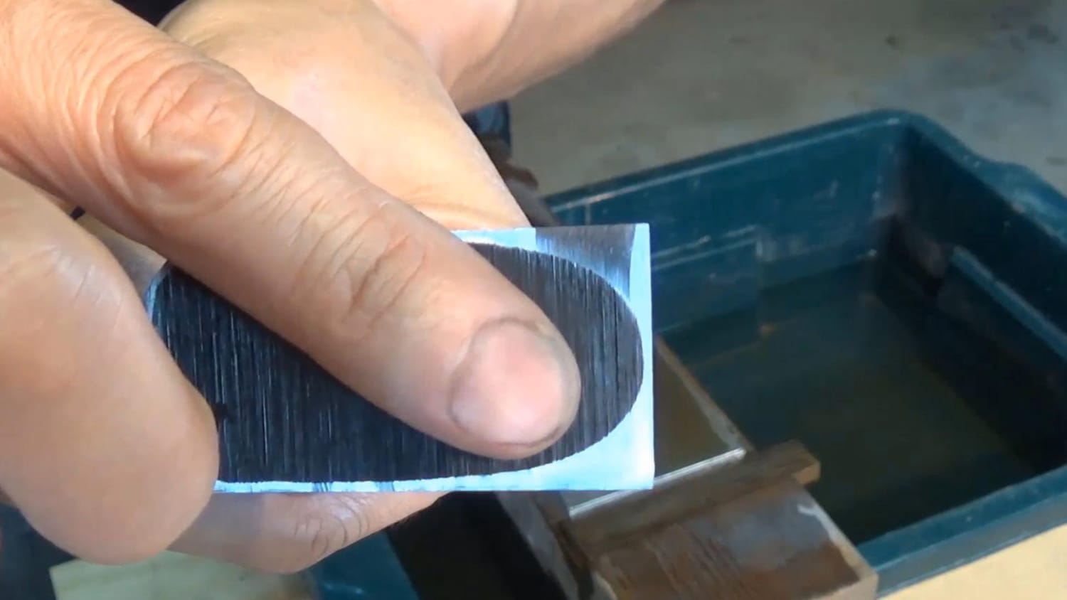 First polished band appearing along the chisel’s backside near the cutting edge.