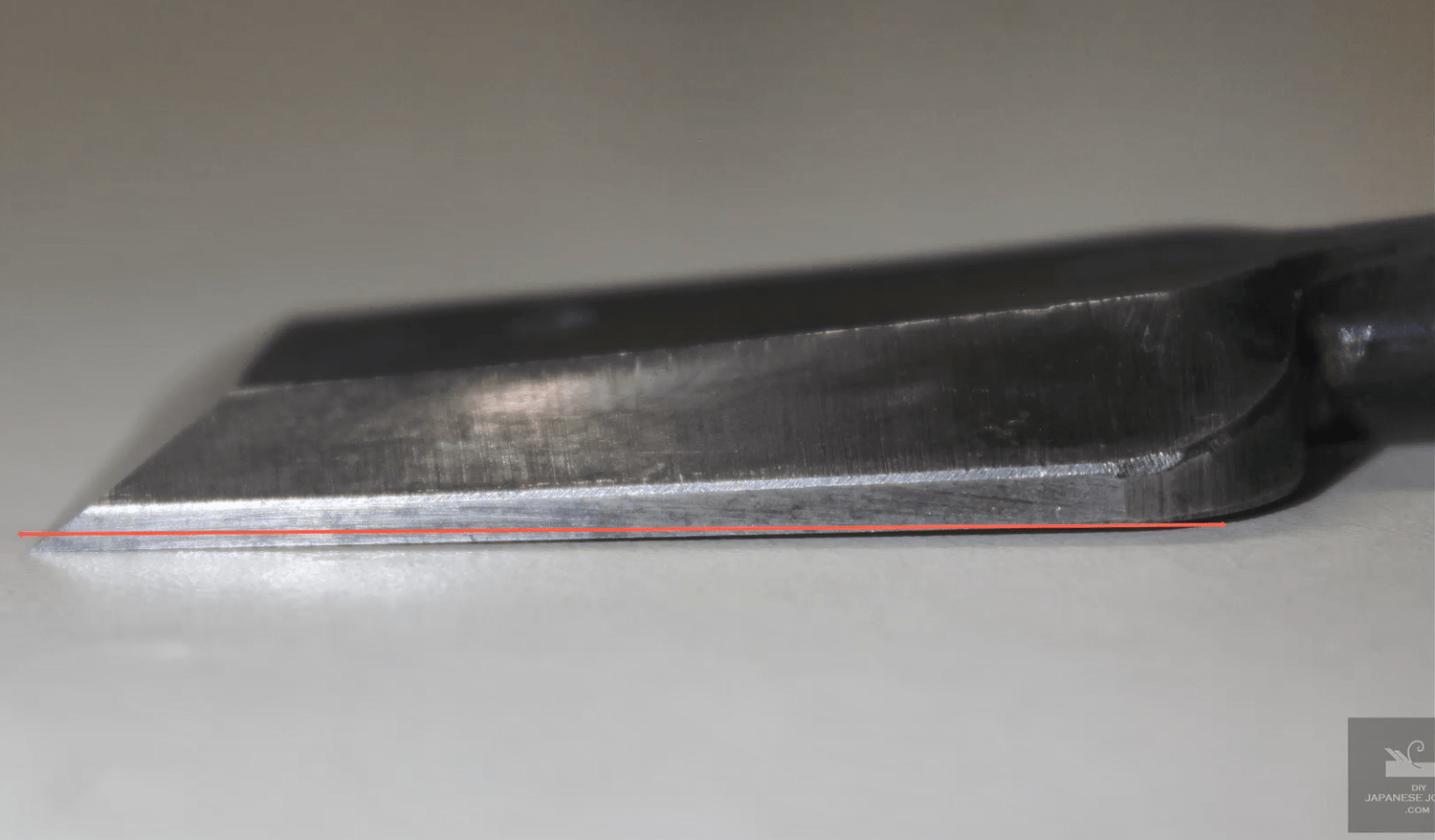 Subtle shallow angle from the cutting edge to preserve the hard steel layer.