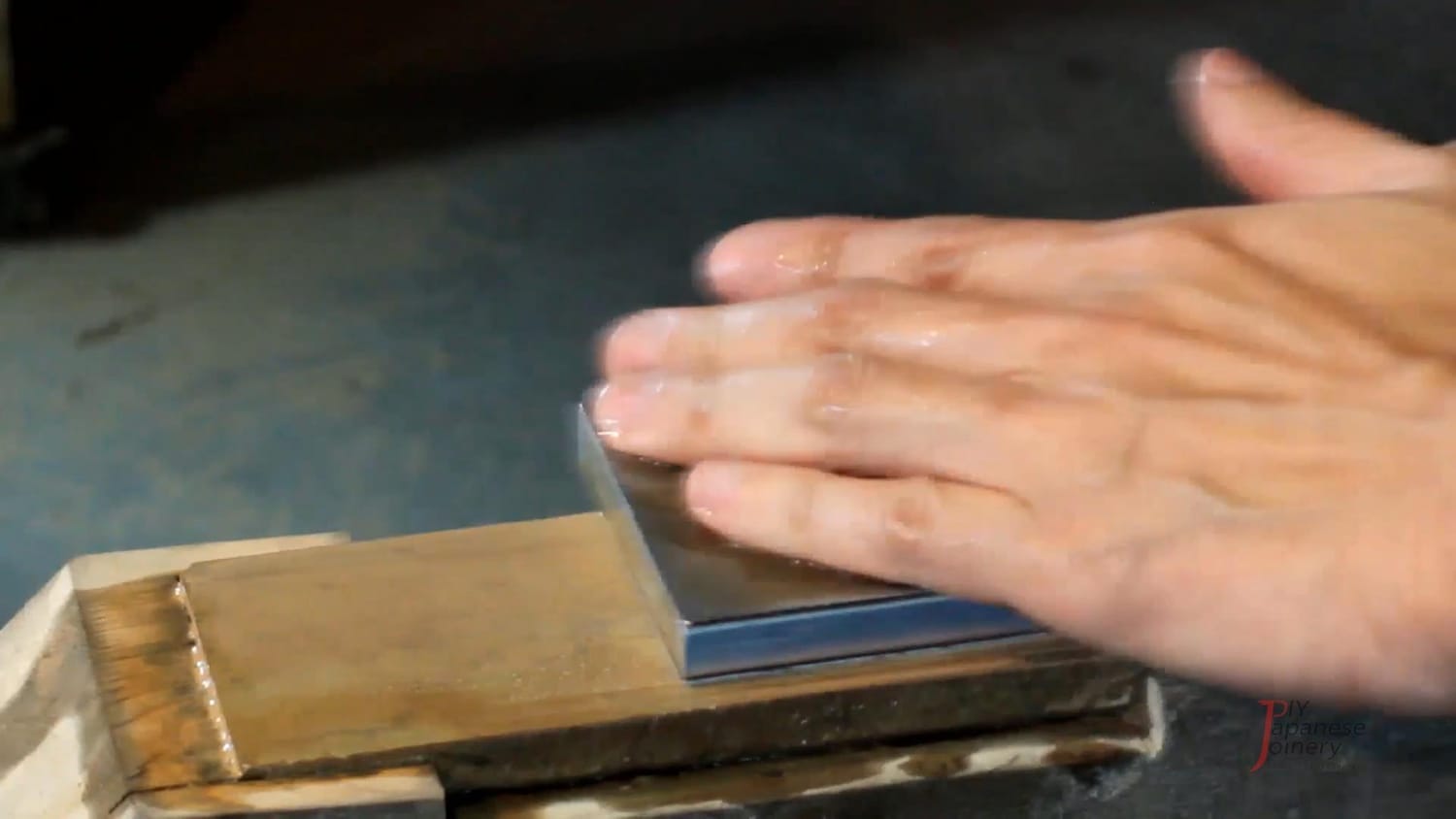 A photo showing a diamond stone flattening a finishing stone.