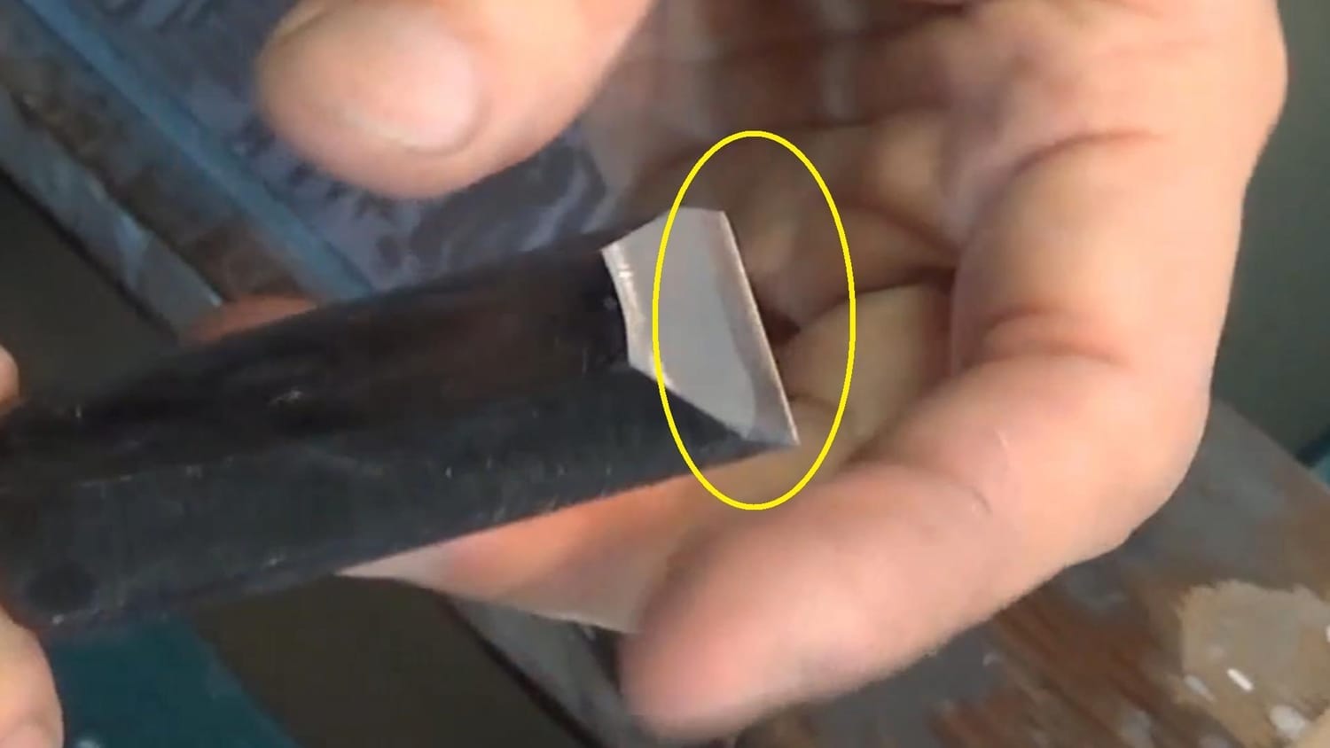 Uneven sharpening where only a small part of the bevel touches the whetstone, creating a shiny band at the edge.
