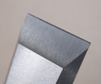 Diagram showing the difference between a primary bevel and a micro-bevel on a chisel edge.