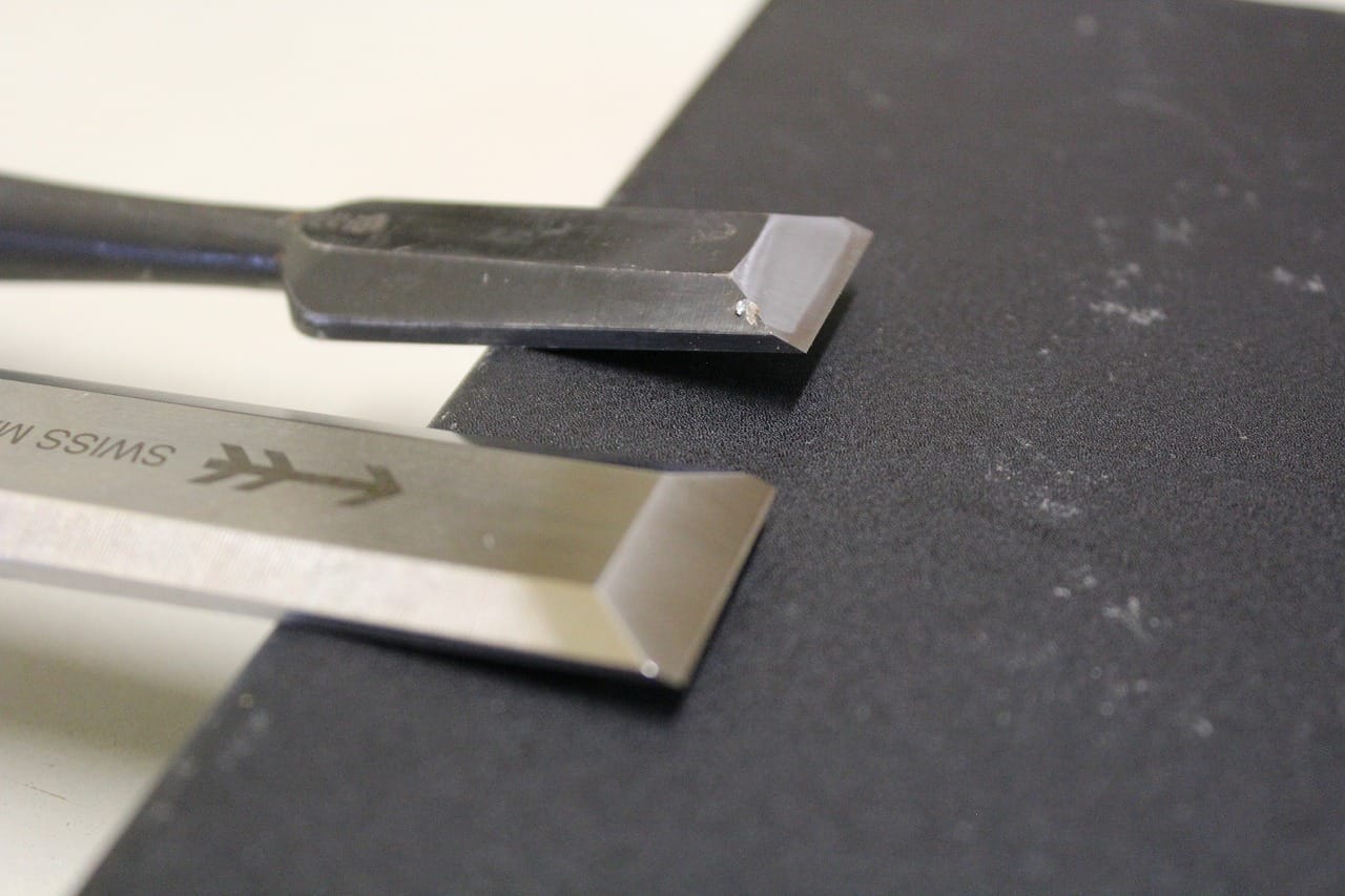 Japanese chisel (nomi) and Western chisel side by side, highlighting the contrast in bevel angle and overall design.