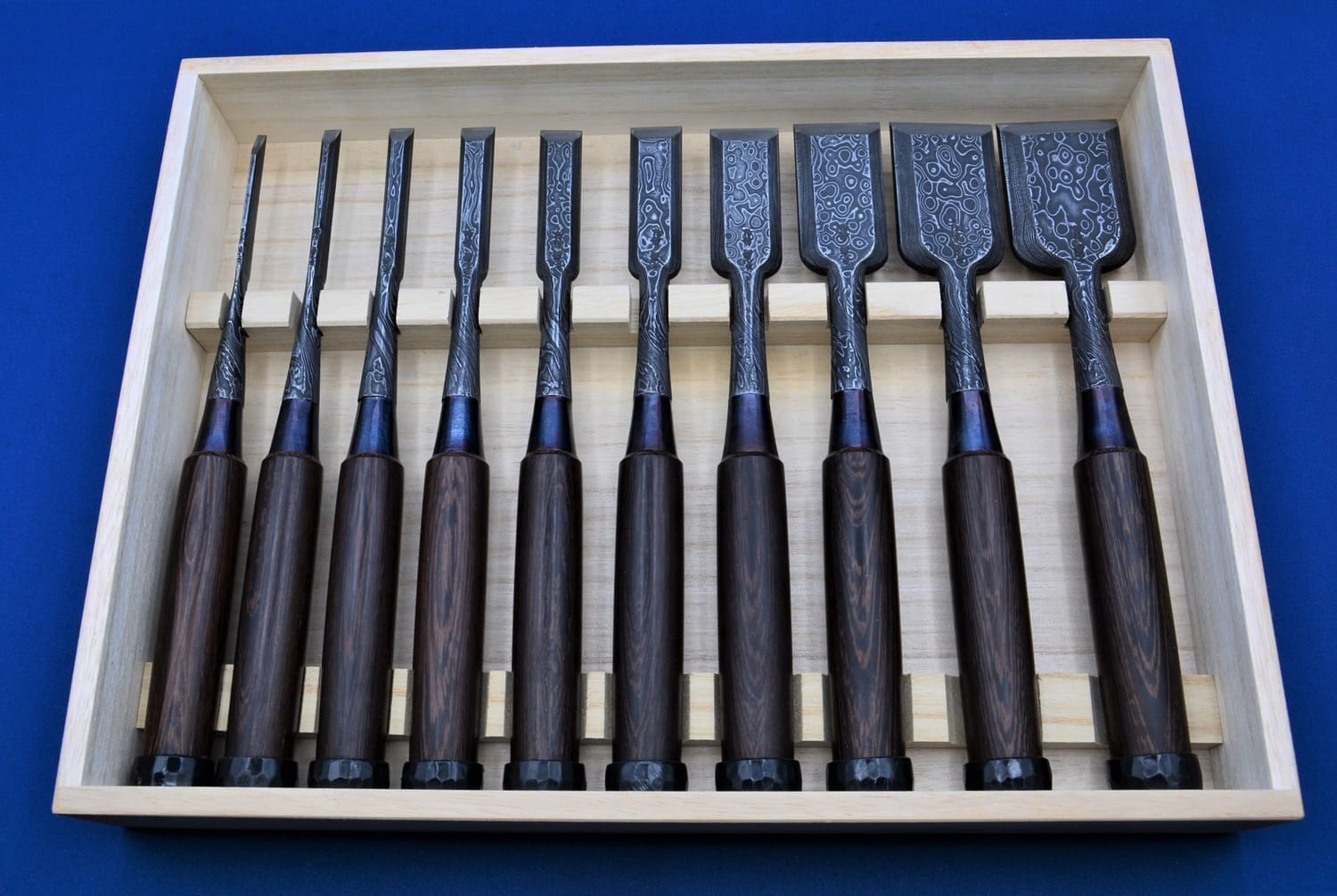 Collection of vintage Japanese woodworking tools displayed as collectible art pieces