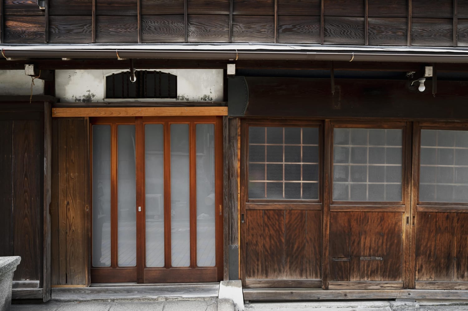 Traditional Japanese townhouse with narrow, deep structure.