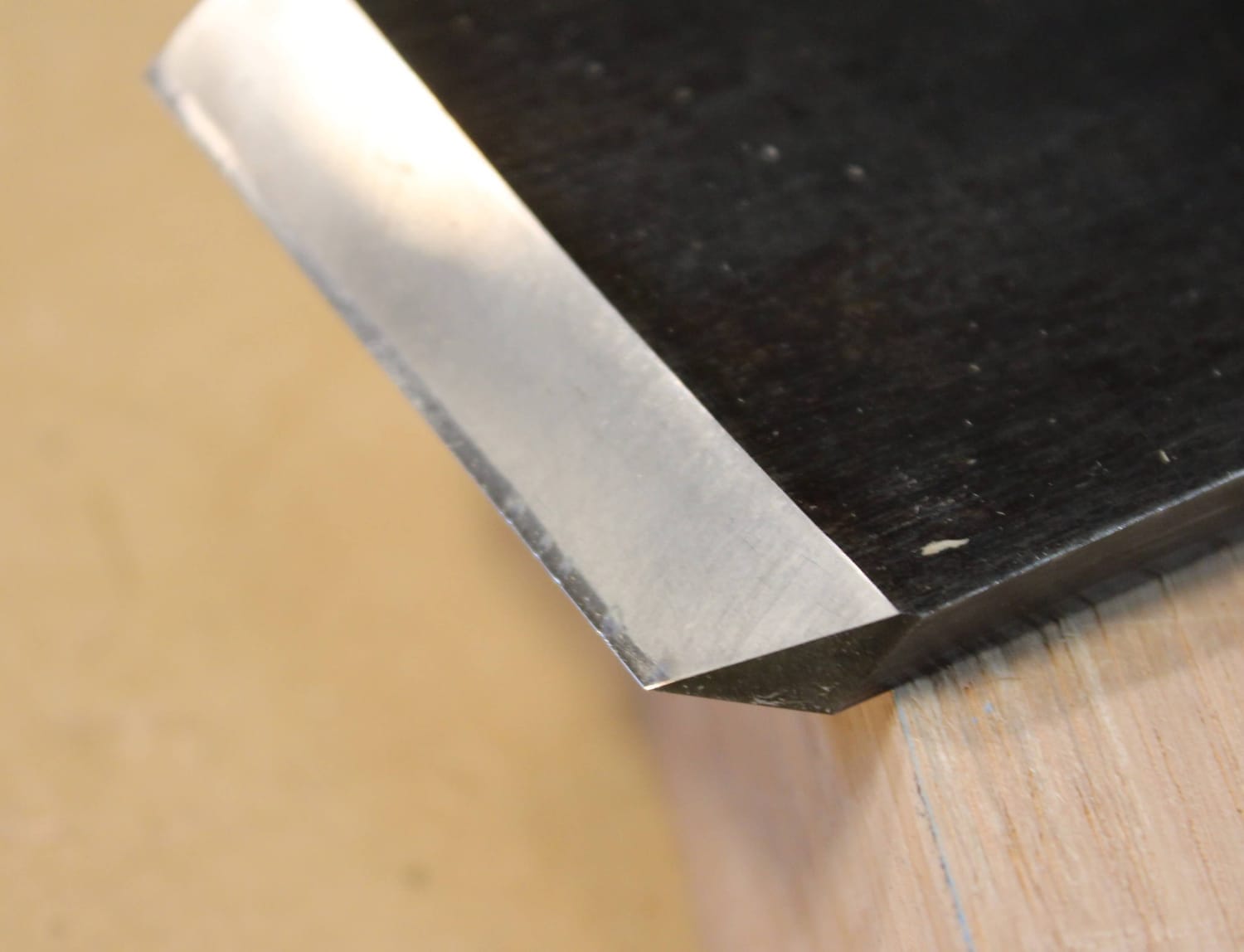 Chisel edge showing small chips under angled light.