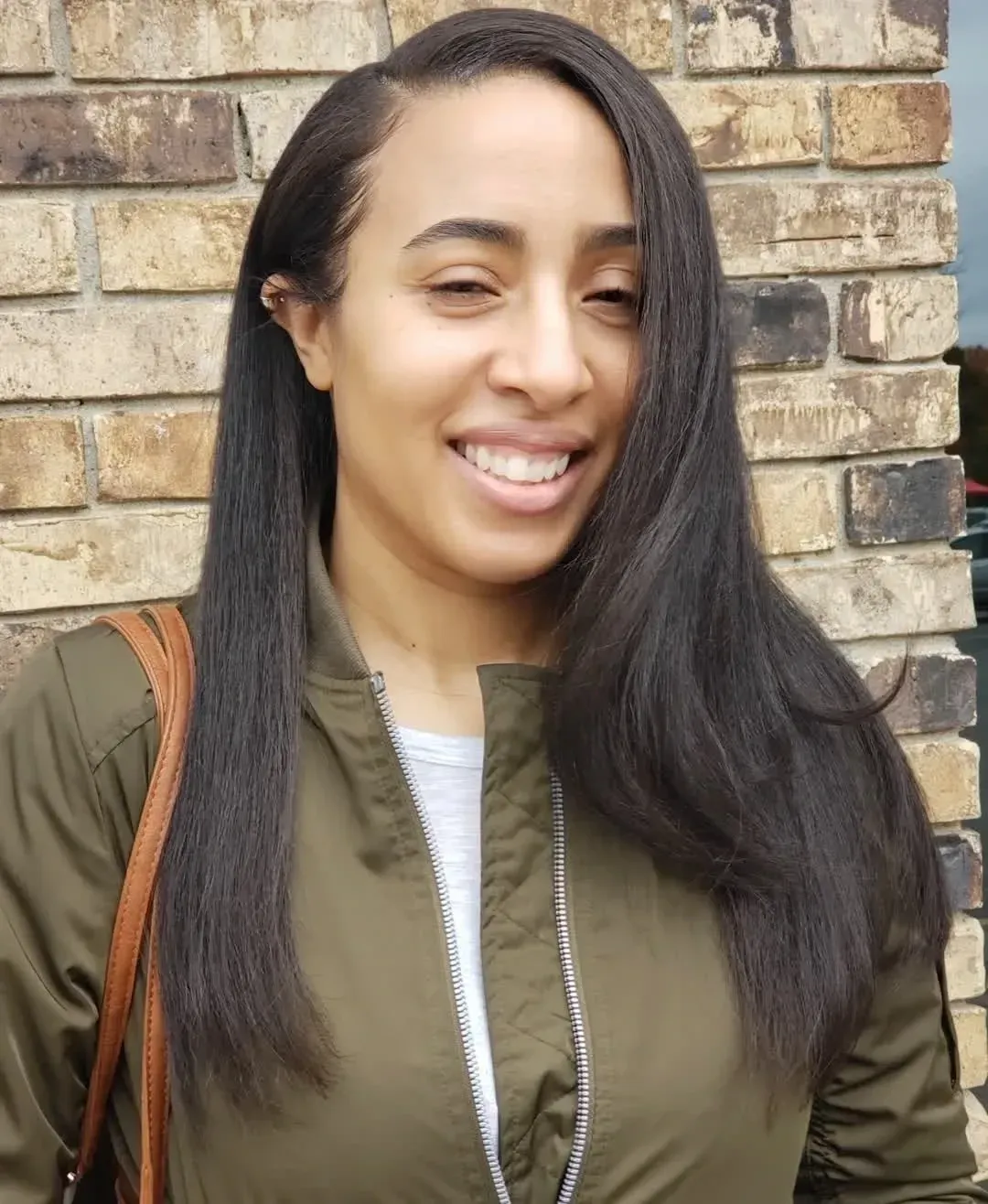 Black women with silk press like hair extensions that match her texture by Sid from hair growth and extensions head spa in OKC