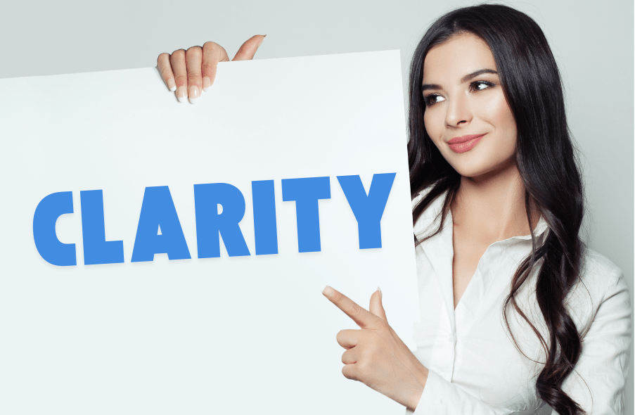 woman with sign saying "clarity"