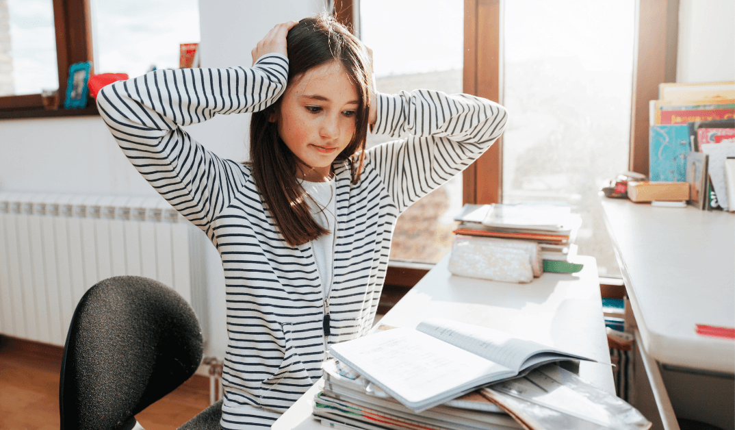 Frustrated teen studying