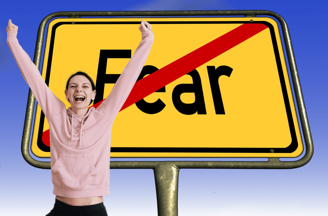 joyful woman with sign - no fear