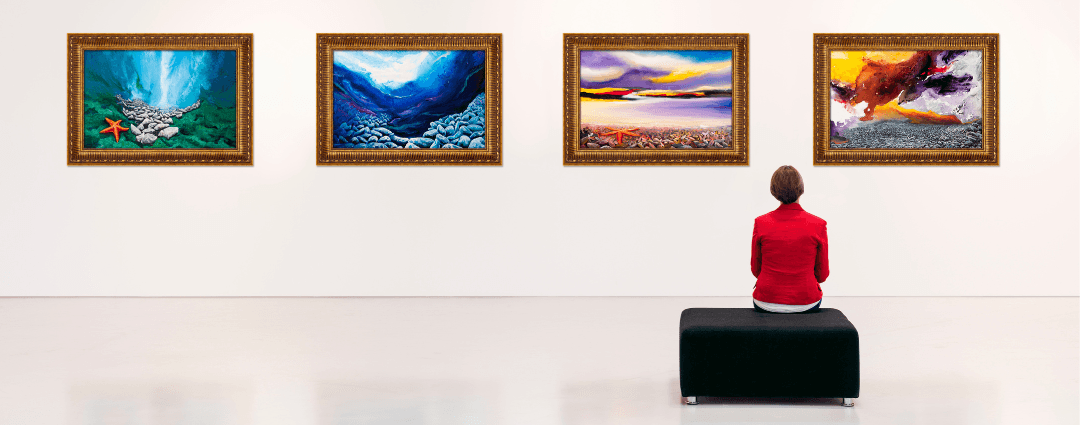 sole person looking at row of paintings