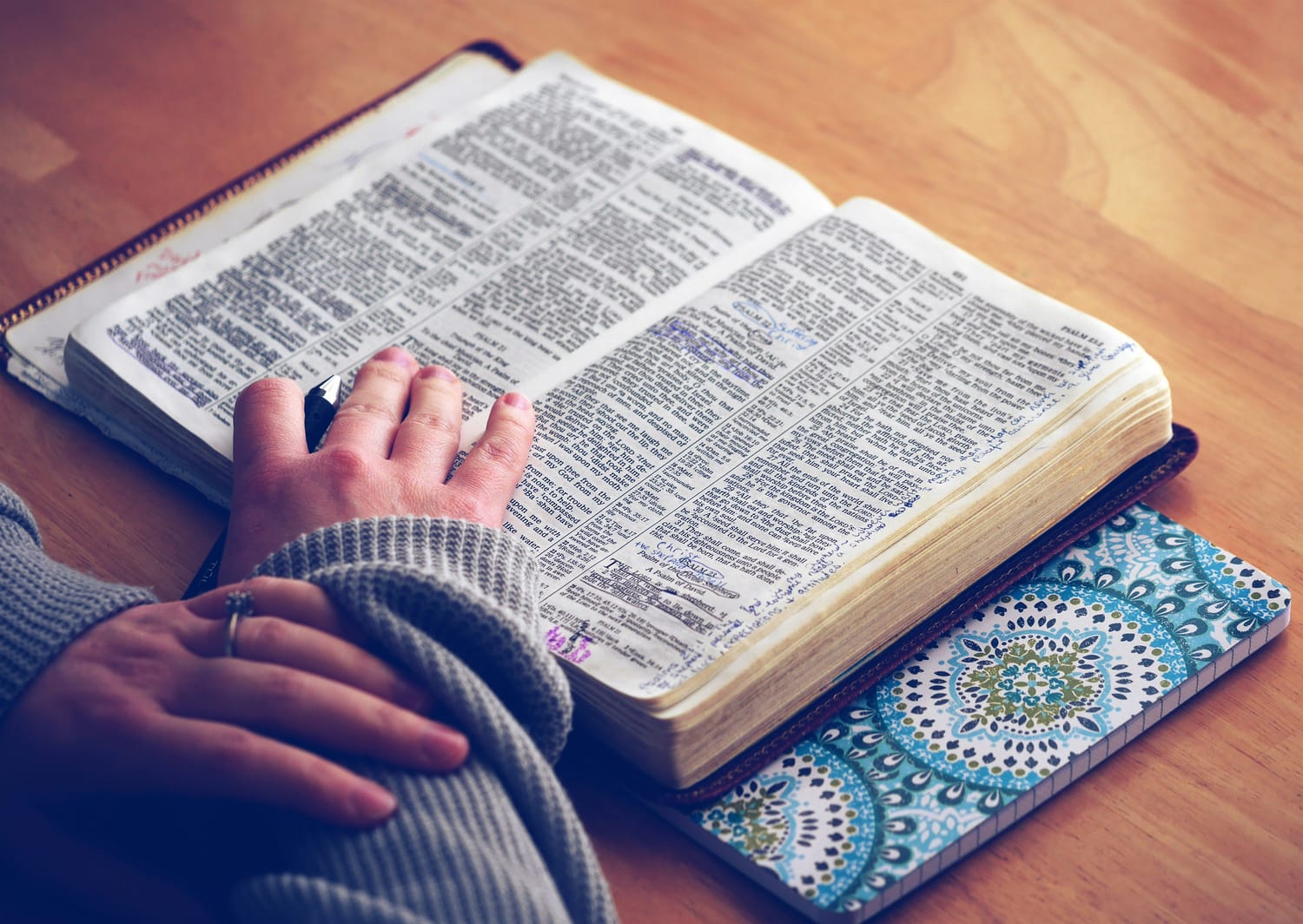 Bible and someone's hand