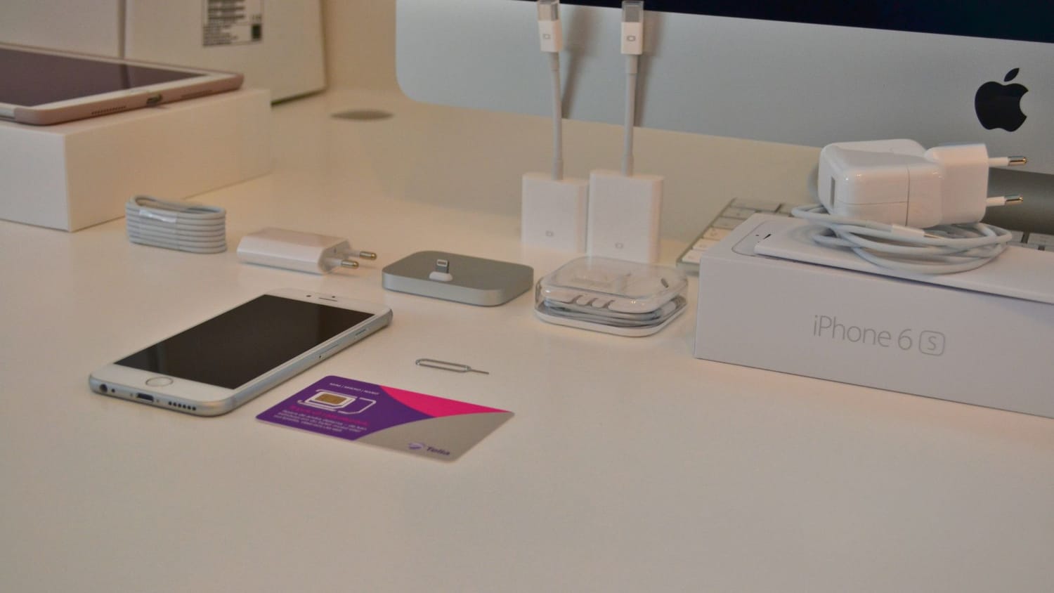 iPhone 6 in 2016. The LakeHouse Media web agency office setup in 2016, featuring a large iMac screen, heavy binders, paper calendars, and complicated tech equipment.