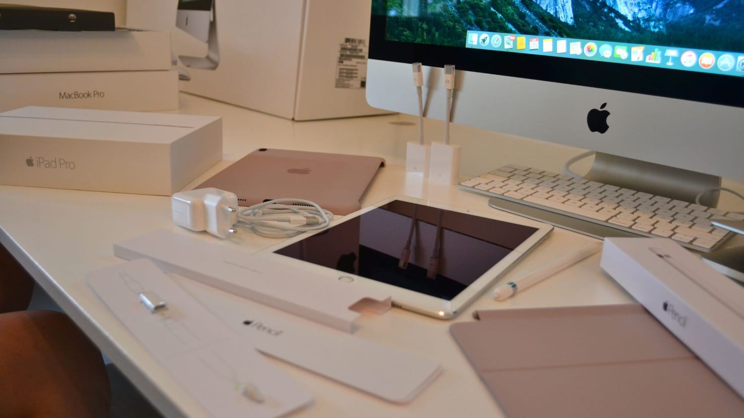 An iPad in 2016. The LakeHouse Media web agency office setup in 2016, featuring a large iMac screen, heavy binders, paper calendars, and complicated tech equipment.
