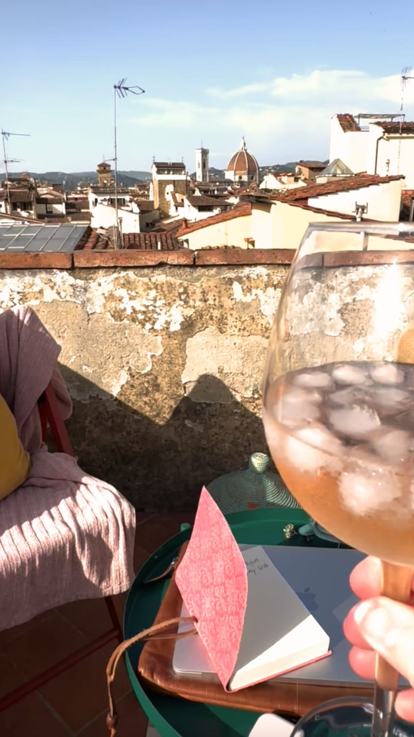 A pink notebook on a rooftop.