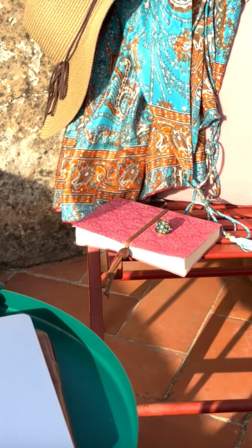 A pink notebook on a rooftop.