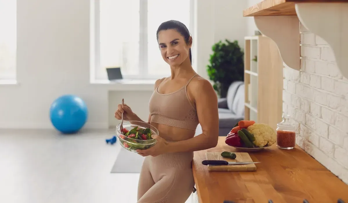 Woman feeling healthy and energetic after healing her gut with a holistic IBS reset