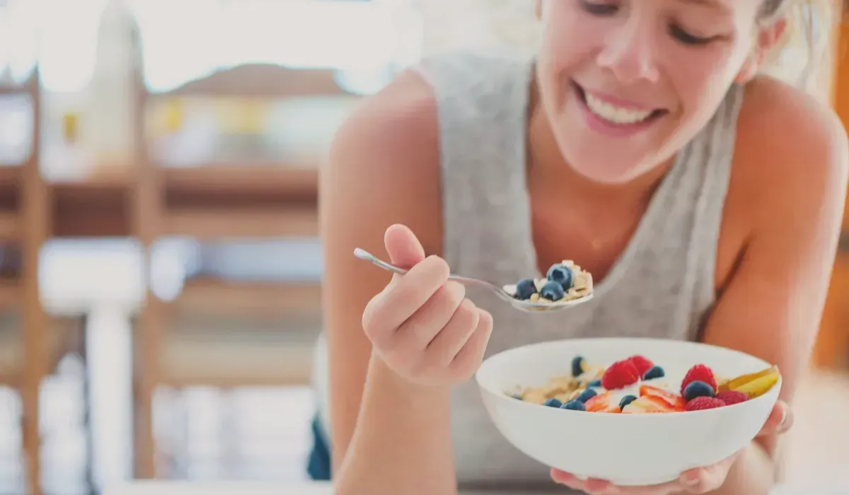 Person enjoying fresh, healthy food during a gut reset program